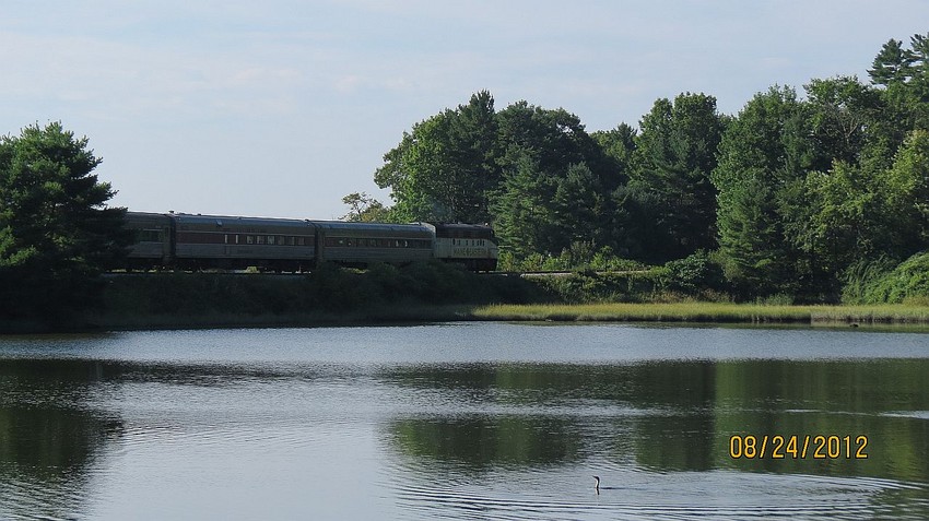 Photo of MER excursion train running through the Salt Bay in Nobleboro, ME.