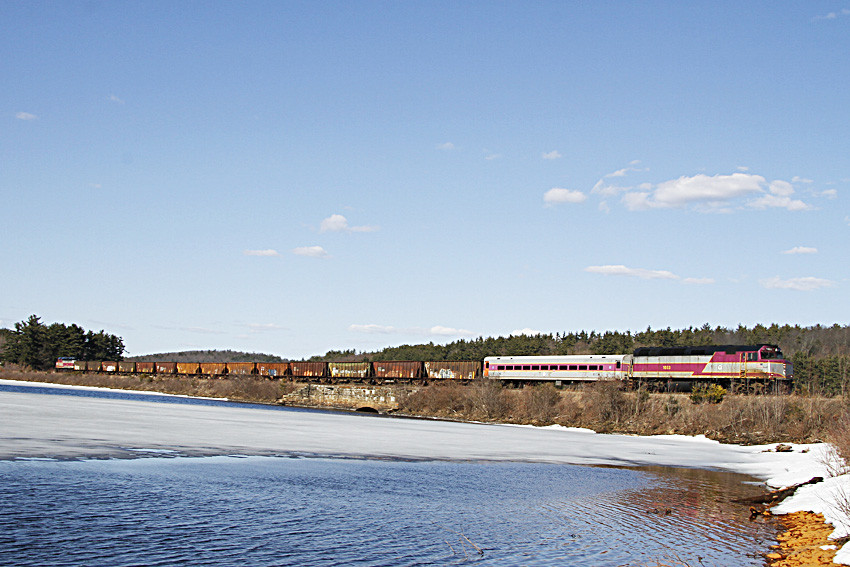 Photo of MBTA equipment move pass the reservoir in West Boylston, MA