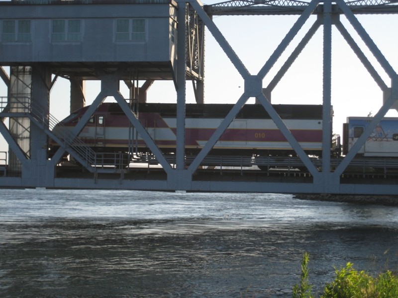 Photo of Cape Flyer with MBTA 010 on the Canal railroad bridge