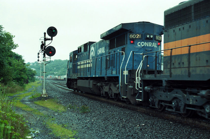 Photo of Conrail 6021 leads a Guilford SD40 at Worcester