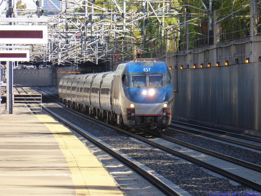 Photo of Amtrak HHP8 657 leads a Regional out of Boston