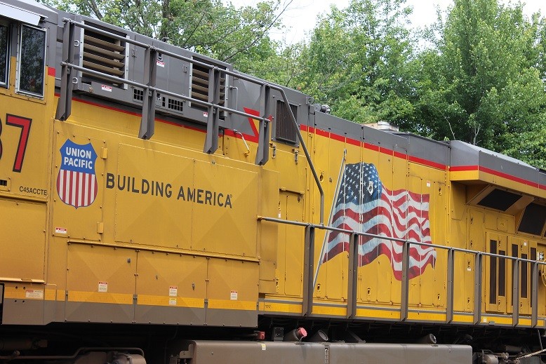 Photo of The American Flag and slogan on the long hood of UP 7987