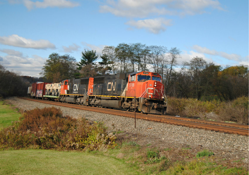 Photo of CSX Q620 With CN and Military vehicles