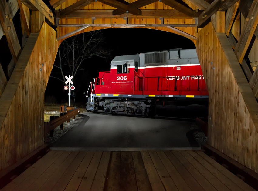 Photo of VTR 206 at night passing Bartonsville Covered Bridge
