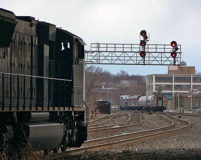 Photo of CSX 437 waits for Amtrak P449 to get out of town