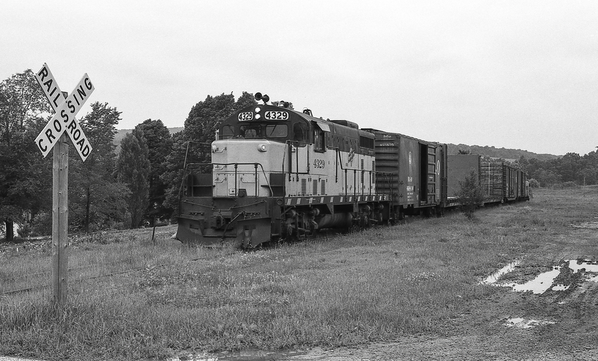 Photo of C&NW 4329 Approaching a Rural Grade Crossing