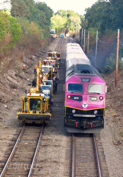 Photo of MBTA Conga Line and Inbound Commuter at Waverley MA