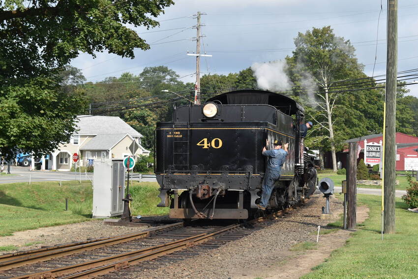 Photo of Valley Railroad #40 backing to its train.